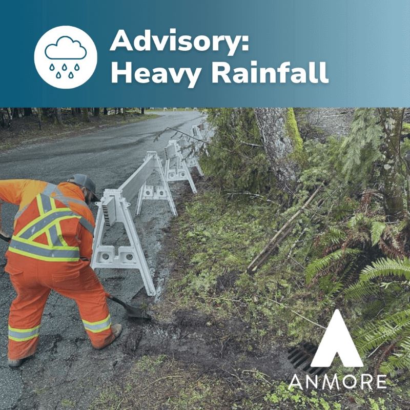 Image of public works team clearing catch basins with an advisory warning on the image for heavy rainfall.