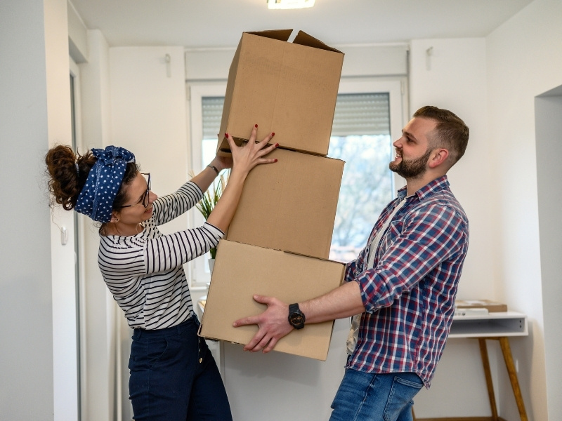 Image of couple with moving boxes.
